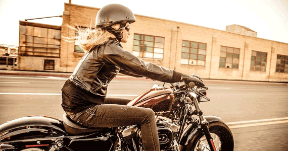 Woman Riding a Harley Davidson Motorcycle